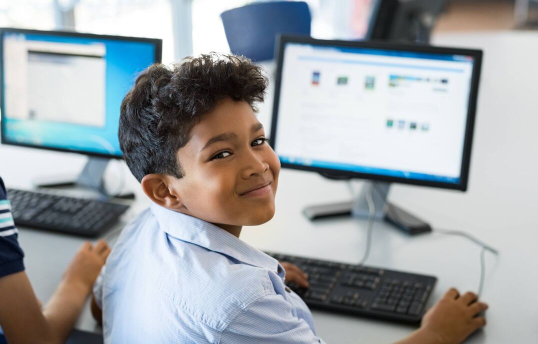 School student in front of computer